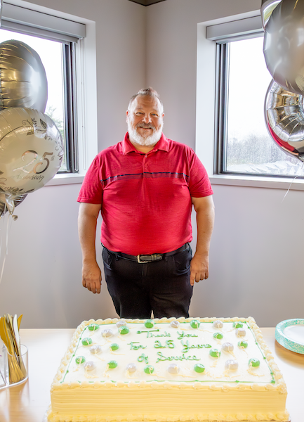 Randy Dicks celebrates his 25th work anniversary at InVision with cake and balloons